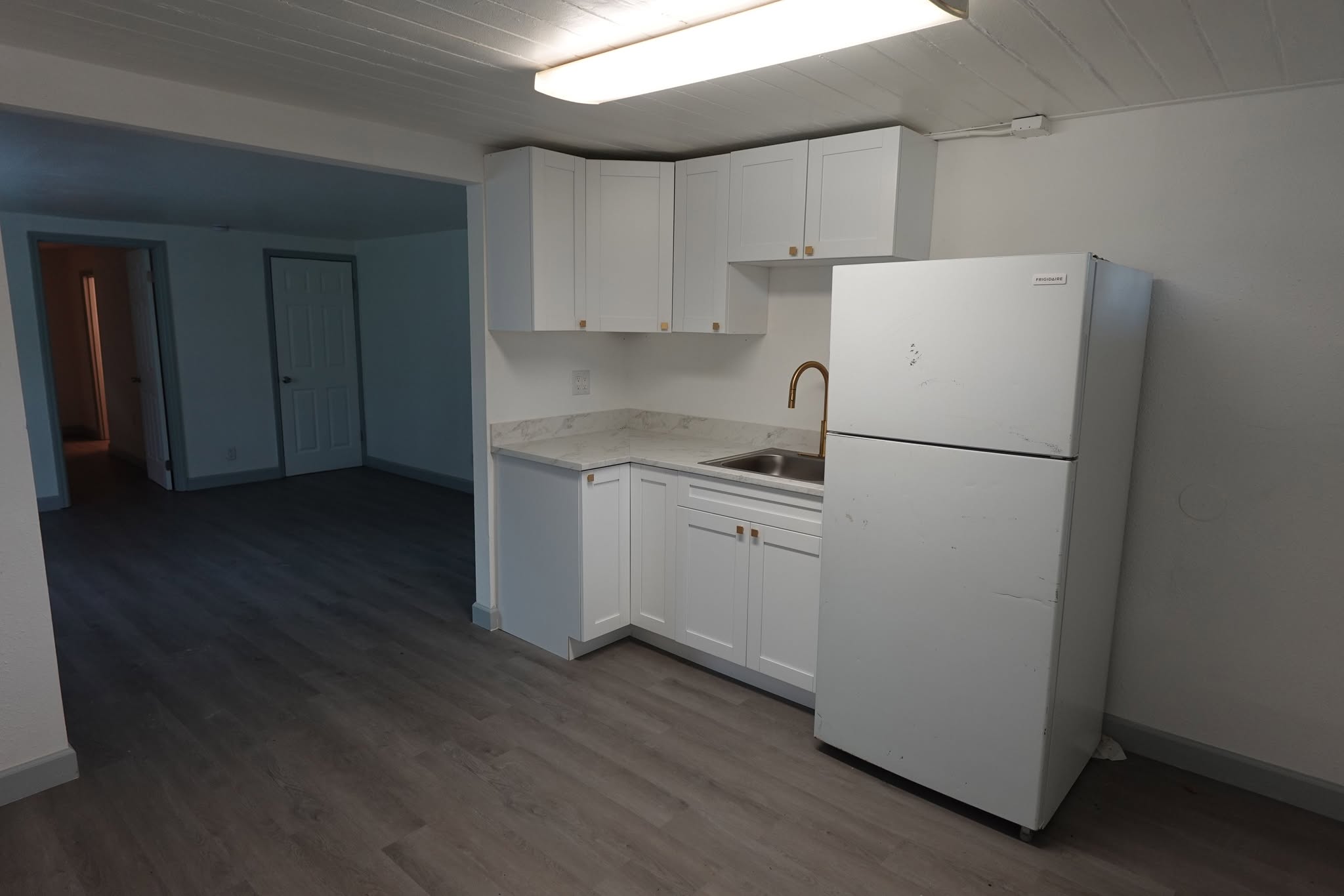 Renovated kitchen with new cabinetry and counters